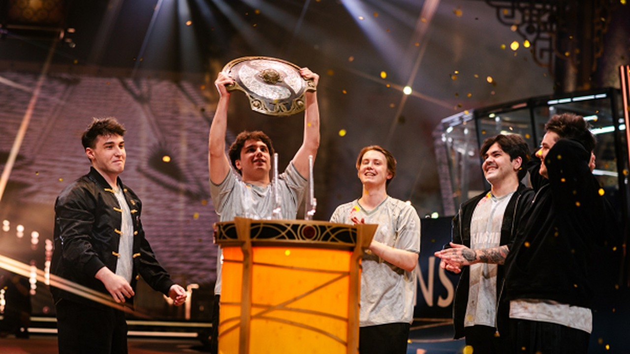 The Team Spirit Dota 2 roster poses with the Aegis in Shanghai